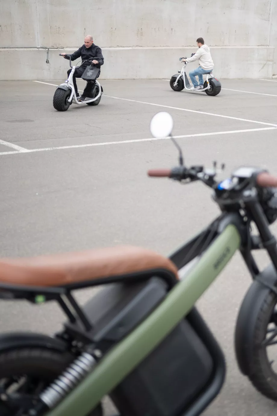 People testing electric vehicles